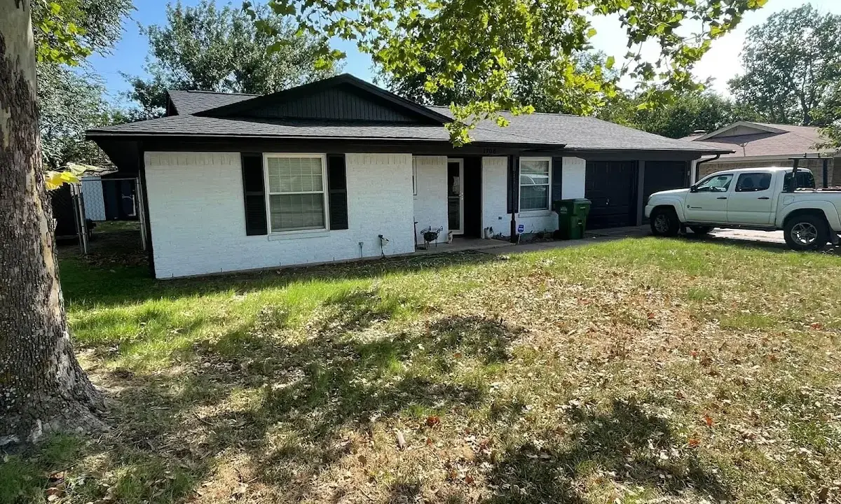 Professional roofing crew working on a residential roof in Bowie